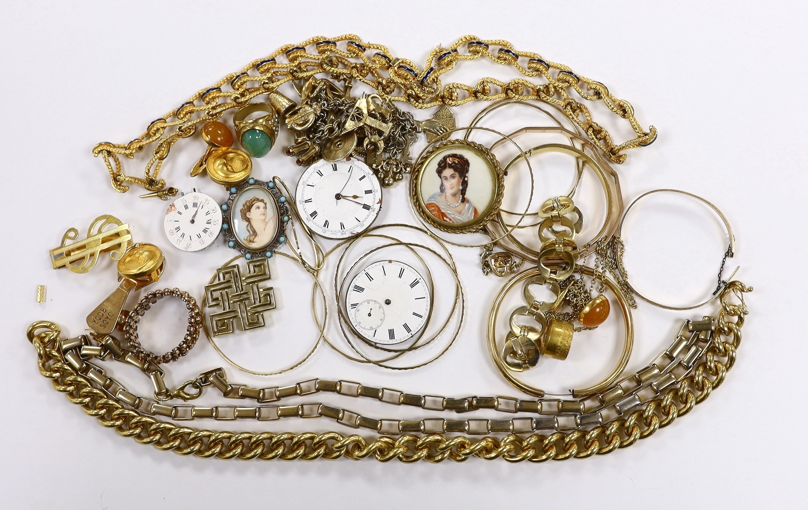 A small quantity of assorted gilt metal or gold plated jewellery, including large cub link necklace, bangles, bracelets, rings, cufflinks etc and three pocket watch movements.